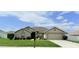 Charming single-story home featuring a well-manicured lawn and a two-car garage at 186 Nw 44Th St, Ocala, FL 34475