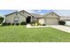 Well-maintained lawn and landscaping enhance the curb appeal of this home at 186 Nw 44Th St, Ocala, FL 34475