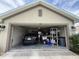 View of a spacious two-car garage with ample storage and a parked vehicle inside the property at 186 Nw 44Th St, Ocala, FL 34475