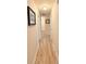 Hallway features neutral walls and floors leading to multiple doors, well-lit overhead at 186 Nw 44Th St, Ocala, FL 34475