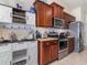 Well-equipped kitchen featuring stainless steel appliances and ample cabinet space at 186 Nw 44Th St, Ocala, FL 34475
