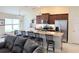 Updated kitchen featuring stainless appliances, granite countertops, and bar stool seating at 186 Nw 44Th St, Ocala, FL 34475