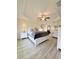 Spacious main bedroom featuring neutral decor, fan, and tray ceiling at 186 Nw 44Th St, Ocala, FL 34475
