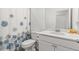 Bathroom featuring a shower-tub combo, white cabinets, and modern fixtures at 19551 Sw 77Th Loop, Dunnellon, FL 34432