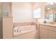 Relaxing bathroom with a garden tub and a standalone shower at 19551 Sw 77Th Loop, Dunnellon, FL 34432