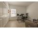 Neutral bedroom features a desk, chair, and a window for natural light at 19551 Sw 77Th Loop, Dunnellon, FL 34432