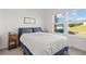 Cozy bedroom featuring natural light, and a sign that says 'Make Yourself at Home' at 19551 Sw 77Th Loop, Dunnellon, FL 34432