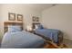 Well-lit bedroom featuring two twin beds, and rustic-style decor at 19551 Sw 77Th Loop, Dunnellon, FL 34432
