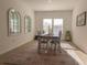 Bright dining room with tile floors, neutral colors, lots of light, and modern decor at 19551 Sw 77Th Loop, Dunnellon, FL 34432