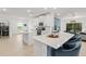 Bright, open kitchen boasting sleek countertops, modern appliances, and an inviting breakfast bar at 19551 Sw 77Th Loop, Dunnellon, FL 34432
