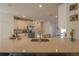 Spacious kitchen with an island, stainless steel appliances, and sleek quartz countertops at 19551 Sw 77Th Loop, Dunnellon, FL 34432