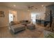 Comfortable living room with stylish furnishings, neutral colors, and an open floor plan at 19551 Sw 77Th Loop, Dunnellon, FL 34432