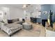Open concept living room with plush seating, modern decor, and a view to the kitchen at 19551 Sw 77Th Loop, Dunnellon, FL 34432