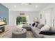 Bright living room featuring comfortable seating, sliding doors to lanai, and a fireplace at 19551 Sw 77Th Loop, Dunnellon, FL 34432