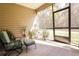 Relaxing screened-in patio with comfortable seating and view of the backyard at 19551 Sw 77Th Loop, Dunnellon, FL 34432
