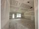 Bright unfinished living room offering exterior access, large windows, and smooth drywall at 2 Pine Course Trl, Ocala, FL 34472