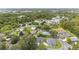 A sprawling residential community surrounded by mature trees and waterways, showcasing peaceful suburban living at 2644 Sw 20 Cir, Ocala, FL 34471