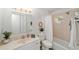 Bathroom with white vanity, toilet, and tiled shower/tub combo at 2644 Sw 20 Cir, Ocala, FL 34471