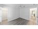 Bedroom with hardwood floors, a ceiling fan, and access to walk-in closet at 2644 Sw 20 Cir, Ocala, FL 34471