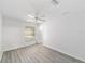 Bedroom with hardwood floors, a ceiling fan, and natural light at 2644 Sw 20 Cir, Ocala, FL 34471