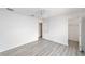 Bedroom featuring hardwood floors, a ceiling fan, and a view of the closet at 2644 Sw 20 Cir, Ocala, FL 34471