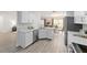 Bright kitchen features quartz countertops, stainless appliances, and an open layout to the dining area at 2644 Sw 20 Cir, Ocala, FL 34471