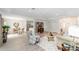 Spacious living room with views of dining room and front entry, with light, neutral walls and floors at 2644 Sw 20 Cir, Ocala, FL 34471