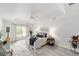 Bright main bedroom showcasing a tray ceiling, ceiling fan, and neutral decor at 2644 Sw 20 Cir, Ocala, FL 34471