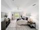 Serene main bedroom features neutral tones, a ceiling fan, and plenty of natural light at 2644 Sw 20 Cir, Ocala, FL 34471