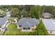 An elevated view of a home featuring a spacious yard, screened-in patio, and a well-maintained landscape at 2644 Sw 20 Cir, Ocala, FL 34471