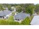 A home with a well-manicured lawn and mature landscaping, viewed from above, highlighting its attractive outdoor features at 2644 Sw 20 Cir, Ocala, FL 34471