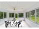 Sunroom with bright windows, a fan, and a table with chairs at 2644 Sw 20 Cir, Ocala, FL 34471
