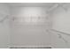 Walk-in closet featuring built-in metal shelves for optimal storage at 2644 Sw 20 Cir, Ocala, FL 34471