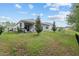 Backyard showing the covered patio, fence, grill and space at 32 Hickory Course Loop, Ocala, FL 34472