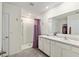 Bathroom with double sinks, walk-in shower, and closet at 32 Hickory Course Loop, Ocala, FL 34472