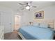 Bright bedroom with a ceiling fan, light walls, and carpet flooring at 32 Hickory Course Loop, Ocala, FL 34472