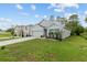 Beautiful home with large lawn, garden and two car garage at 32 Hickory Course Loop, Ocala, FL 34472
