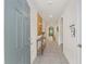 Hallway features arched doorways, tiled floors, and neutral colors at 32 Hickory Course Loop, Ocala, FL 34472