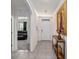 Hallway view featuring tile floors and an arched doorway at 32 Hickory Course Loop, Ocala, FL 34472