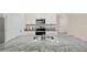 Kitchen featuring granite countertops, a stainless double sink, and seating at the kitchen island at 32 Hickory Course Loop, Ocala, FL 34472