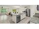 Bright kitchen with stainless steel appliances, granite counters, and a center island with a double sink at 32 Hickory Course Loop, Ocala, FL 34472