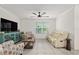 Comfortable living room with bright window and a relaxing space to enjoy time at 32 Hickory Course Loop, Ocala, FL 34472