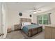 Relaxing main bedroom offers a bright window with plenty of natural light and neutral décor at 32 Hickory Course Loop, Ocala, FL 34472