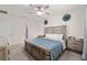 Bright main bedroom features ensuite bathroom and a double dresser at 32 Hickory Course Loop, Ocala, FL 34472