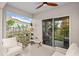 Covered patio with views of the outdoors and a sliding glass door at 32 Hickory Course Loop, Ocala, FL 34472