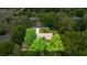 An aerial view showcases the home's position within a lush green landscape and neighborhood at 3331 Se 4Th St, Ocala, FL 34471