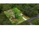 An aerial image highlights the home and surrounding mature trees in a residential area at 3331 Se 4Th St, Ocala, FL 34471