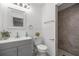 Bright bathroom featuring a modern vanity and a walk-in shower with stylish tiling at 3331 Se 4Th St, Ocala, FL 34471