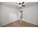 An empty bedroom with neutral walls, ceiling fan, and carpeted floors at 3331 Se 4Th St, Ocala, FL 34471