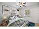 Cozy bedroom with a ceiling fan and two windows at 3331 Se 4Th St, Ocala, FL 34471